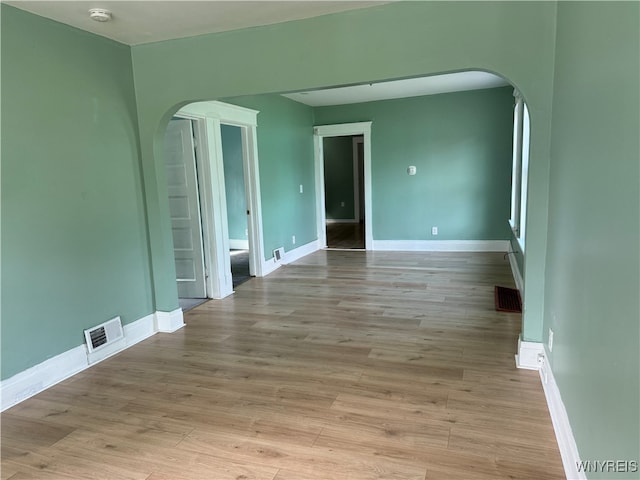 spare room with light hardwood / wood-style flooring