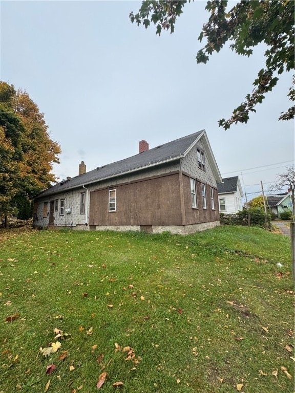 view of property exterior featuring a yard