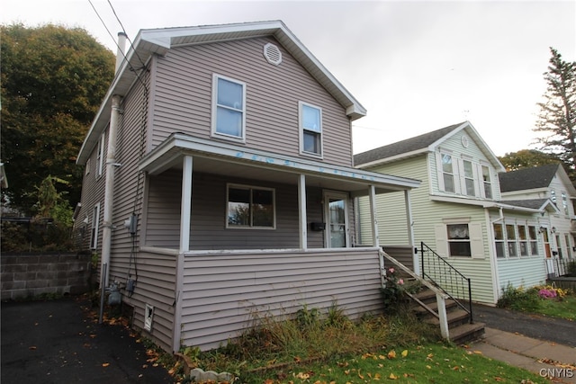 view of front of home featuring covered porch