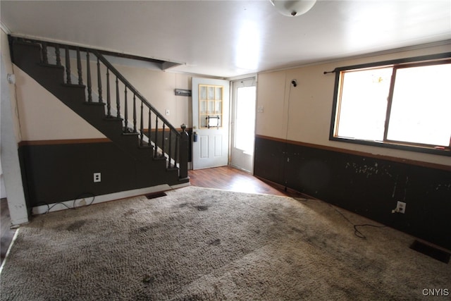 foyer entrance with hardwood / wood-style floors