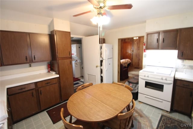 kitchen featuring white appliances, ceiling fan, and dark brown cabinetry