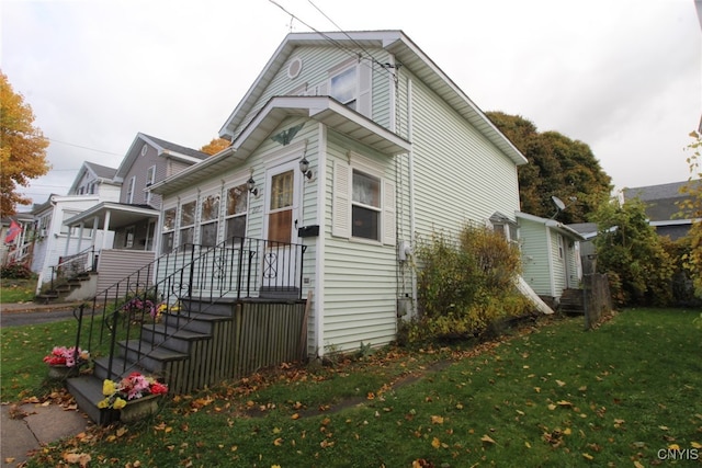 view of property exterior featuring a yard