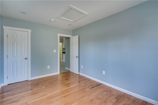 spare room featuring light hardwood / wood-style flooring