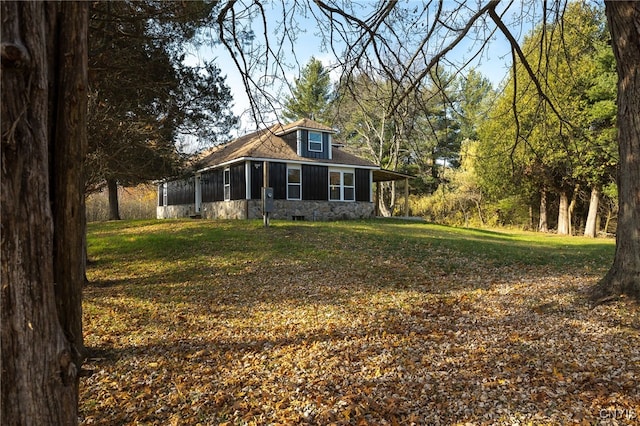 exterior space with a sunroom and a yard