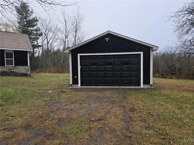 garage featuring a yard