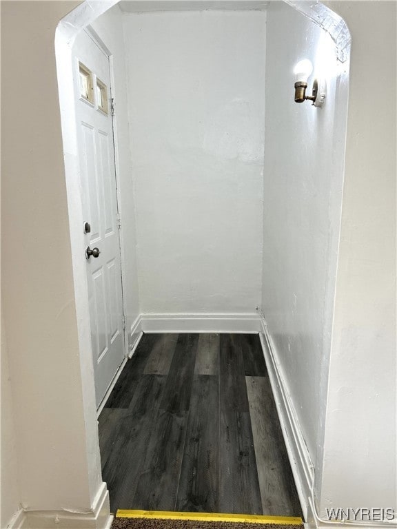 hallway featuring dark hardwood / wood-style floors