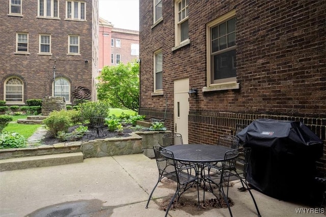 view of patio / terrace with outdoor dining space and a grill