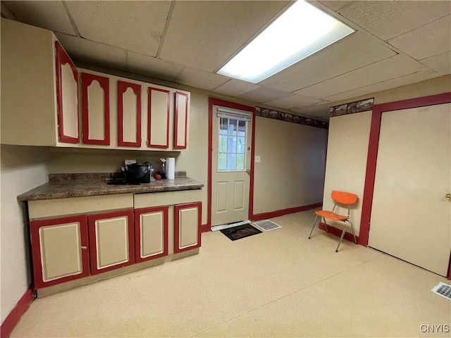 kitchen featuring a drop ceiling