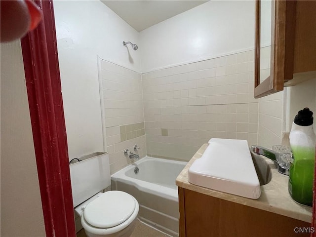 bathroom featuring shower / tub combination and toilet