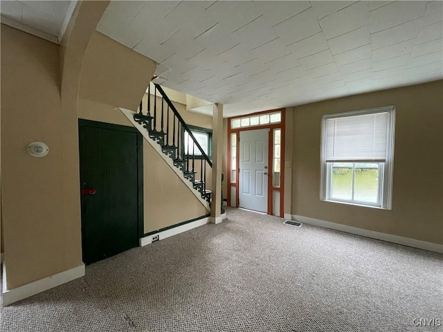 entrance foyer with carpet