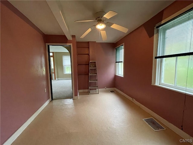 unfurnished room with ceiling fan