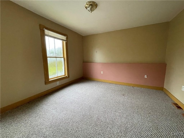 empty room with carpet flooring