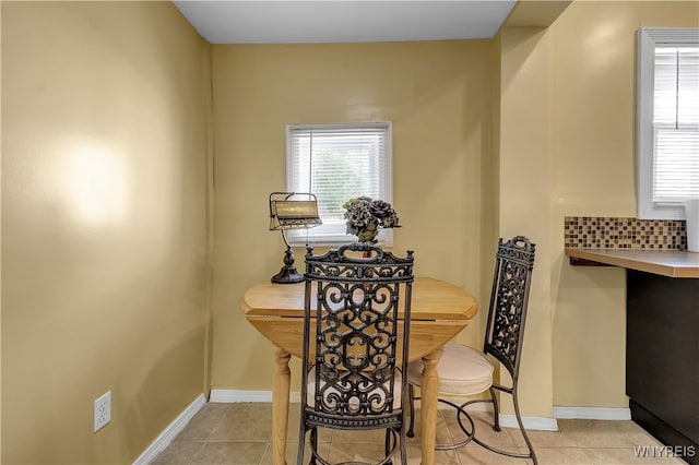 dining area featuring light tile patterned floors