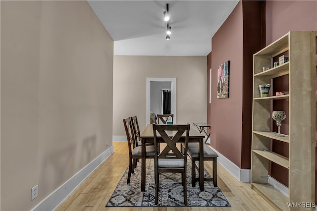 dining area with light hardwood / wood-style floors