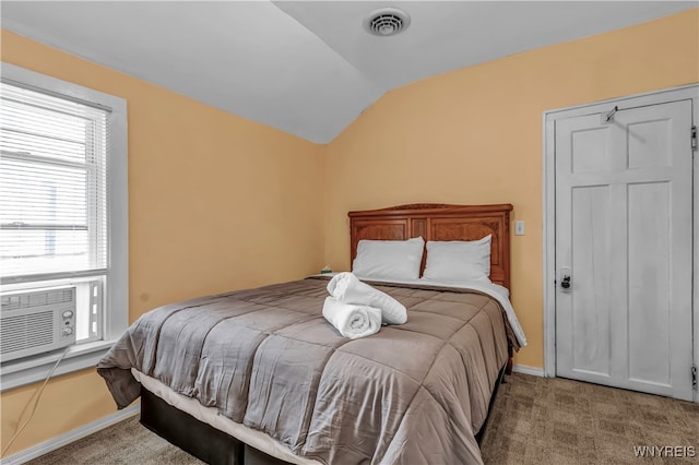 carpeted bedroom with lofted ceiling and cooling unit