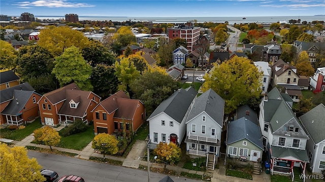 birds eye view of property with a water view