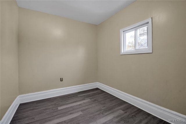 empty room featuring dark hardwood / wood-style floors