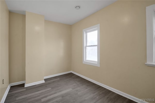 unfurnished room with hardwood / wood-style flooring