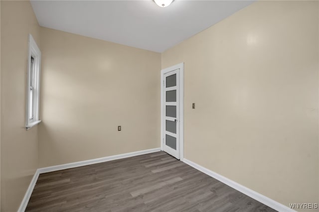 unfurnished room featuring hardwood / wood-style flooring