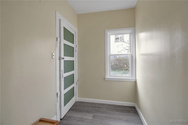 unfurnished room with wood-type flooring