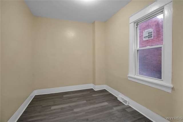 unfurnished room featuring dark hardwood / wood-style floors