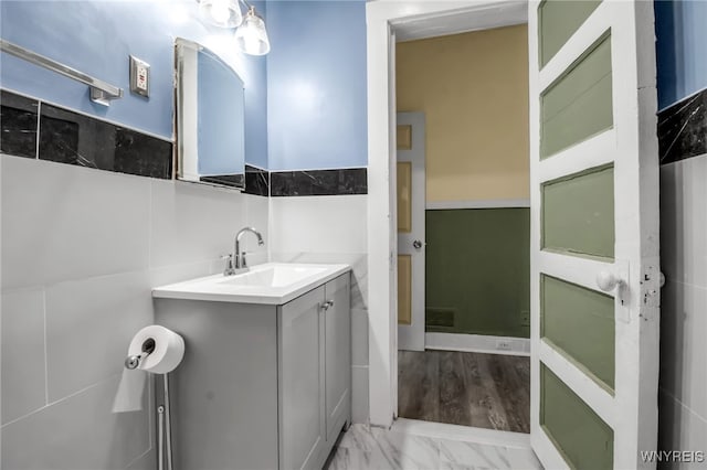 bathroom with vanity and hardwood / wood-style flooring