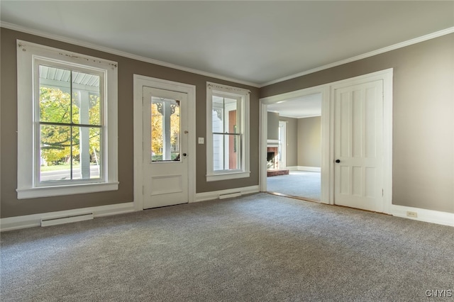 entryway featuring crown molding and carpet floors