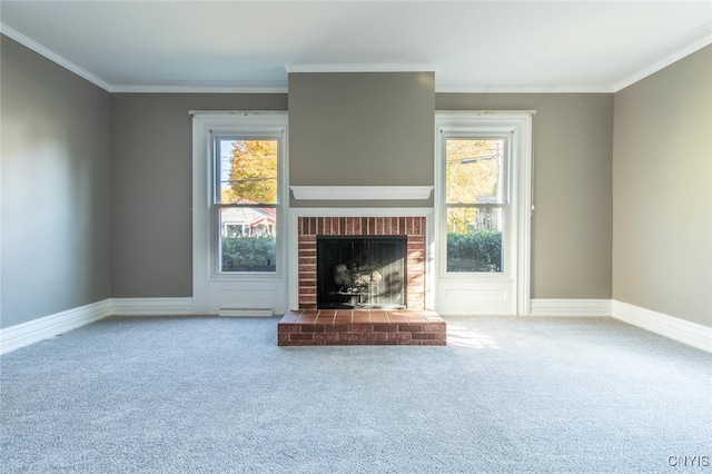 unfurnished living room featuring crown molding, carpet flooring, and a brick fireplace