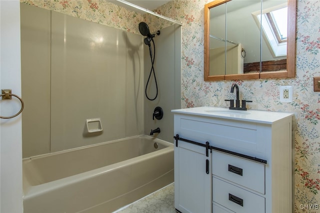 bathroom with vanity, a skylight, and shower / tub combination