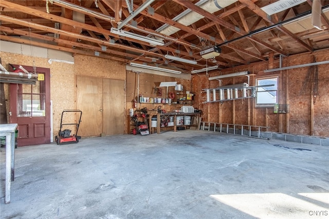 garage featuring a workshop area and a garage door opener