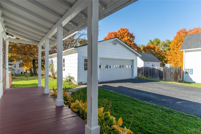 exterior space featuring a lawn and a garage