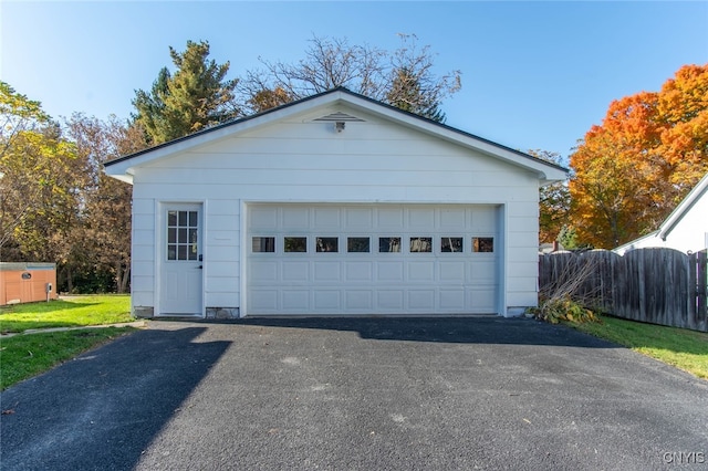 garage featuring a yard