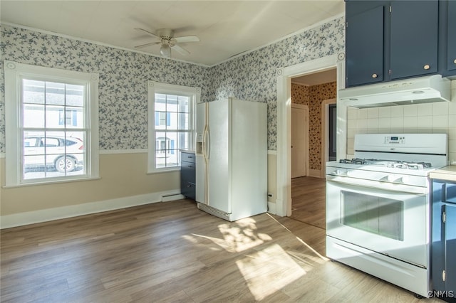 kitchen featuring baseboard heating, hardwood / wood-style floors, blue cabinets, white appliances, and ceiling fan