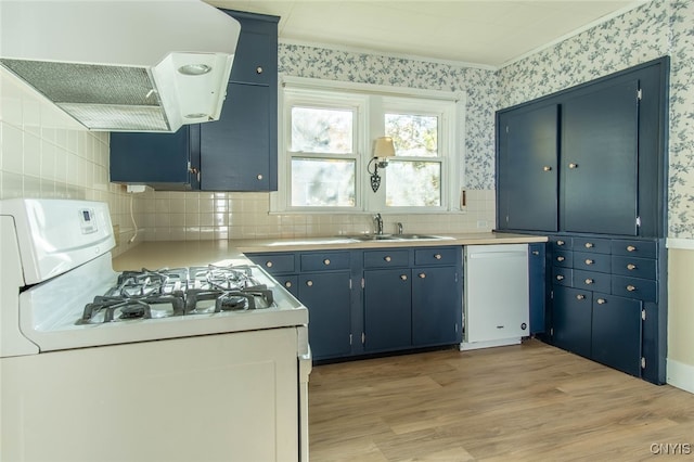 kitchen featuring extractor fan, light hardwood / wood-style flooring, sink, white appliances, and tasteful backsplash