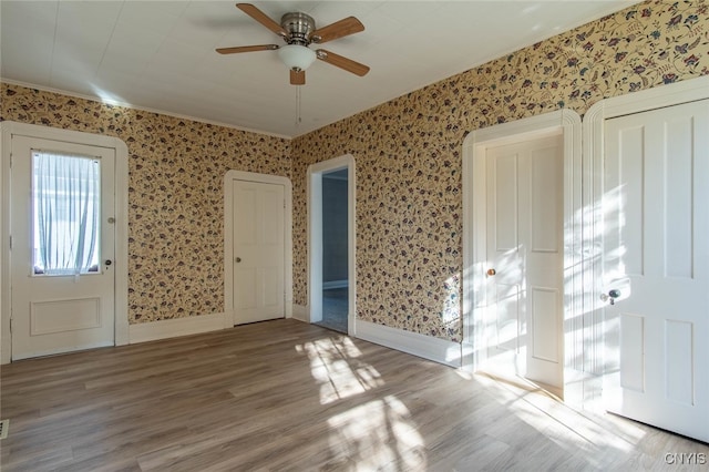 entryway featuring light hardwood / wood-style floors and ceiling fan