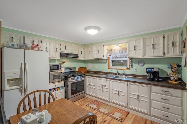 kitchen with white cabinets, light wood-type flooring, ornamental molding, sink, and stainless steel appliances