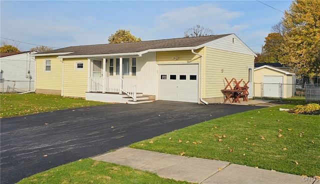 ranch-style home with a front lawn and a garage