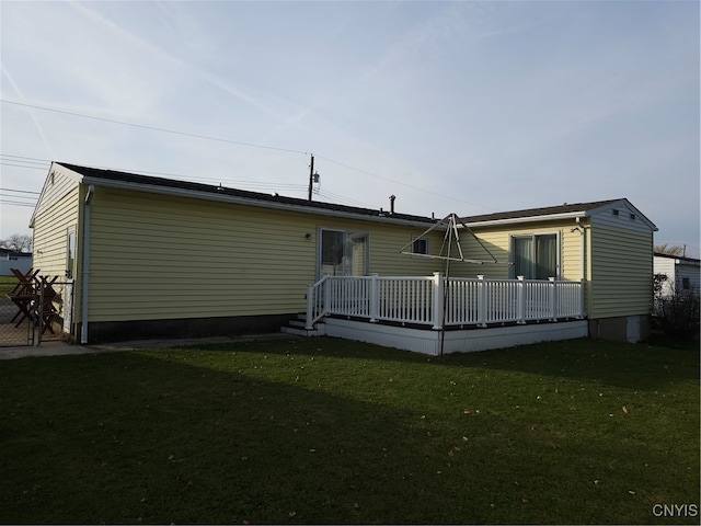 rear view of house with a yard