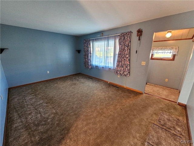 spare room featuring carpet floors