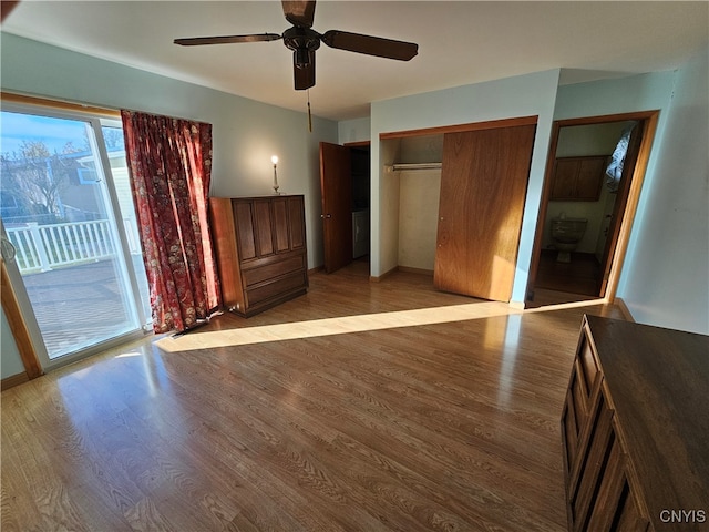 unfurnished bedroom featuring a closet, light hardwood / wood-style floors, access to exterior, and ceiling fan