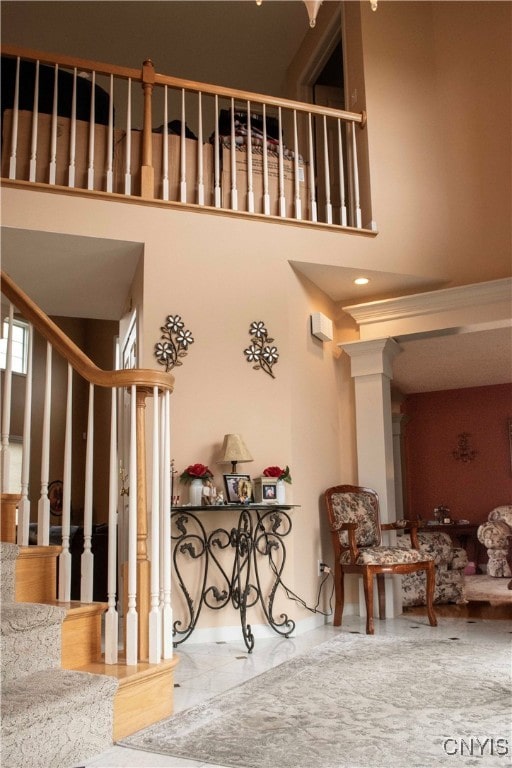 stairs featuring a high ceiling