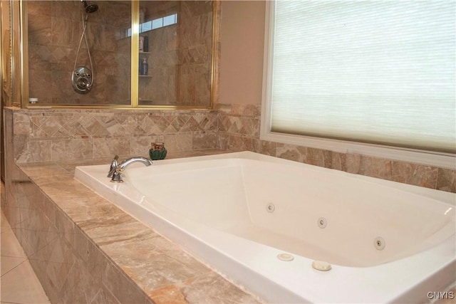 bathroom with tiled bath