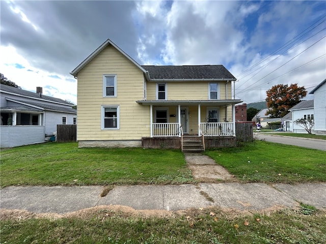 view of front facade with a porch and a front yard