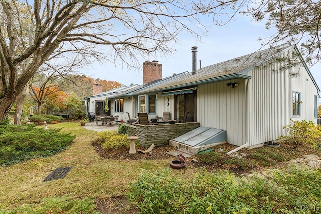 back of property with a patio area