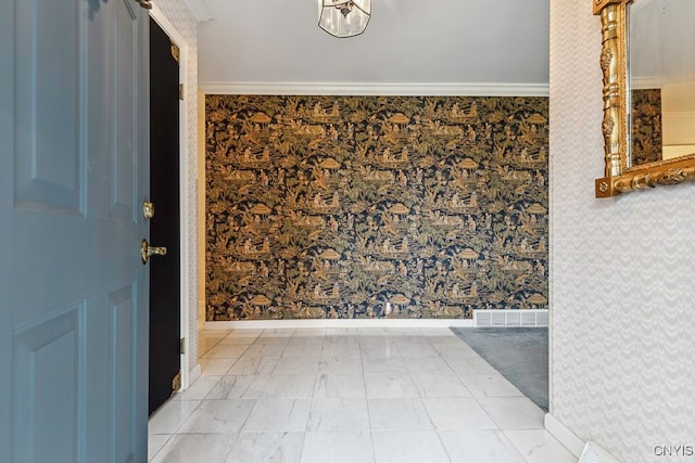 entrance foyer featuring ornamental molding