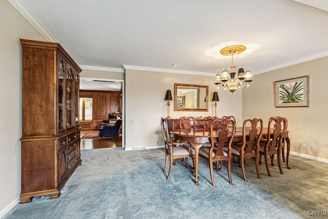 dining room with a chandelier, crown molding, and carpet