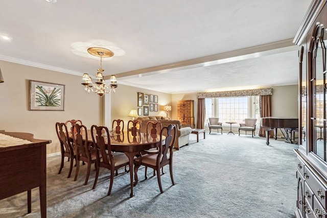 carpeted dining room featuring ornamental molding and an inviting chandelier