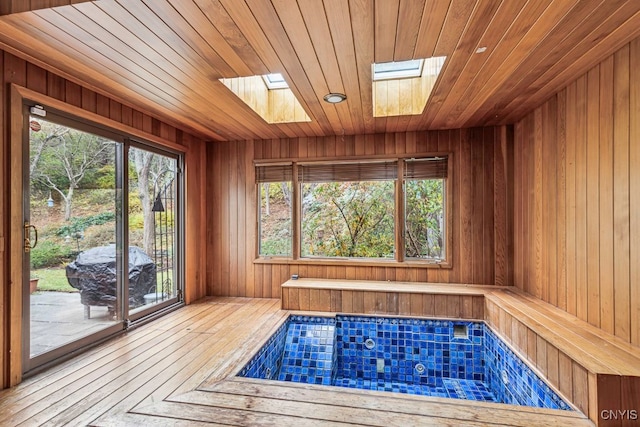 view of sauna / steam room with wood walls, wooden ceiling, and hardwood / wood-style floors