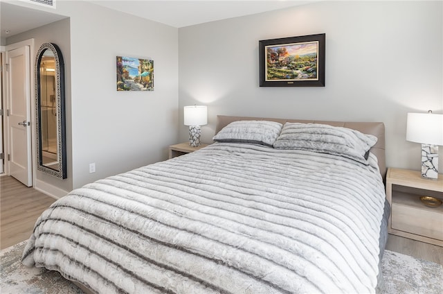 bedroom with light wood-type flooring