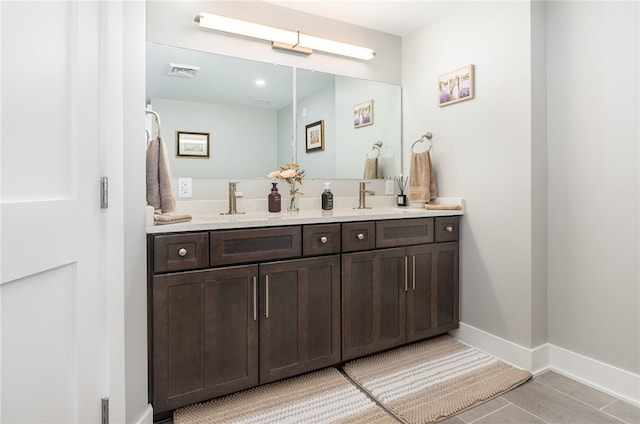 bathroom with vanity and tile patterned flooring